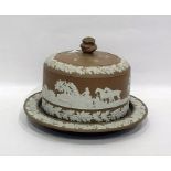 Stoneware cheese dish and cover having applied relief decoration depicting hunting scene frieze