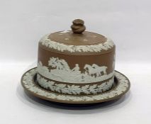 Stoneware cheese dish and cover having applied relief decoration depicting hunting scene frieze