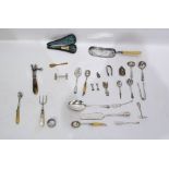 Quantity of silver plate to include lamb joint leg holder, decorative spoons, pair of bone-handled
