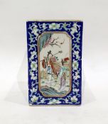 Chinese porcelain vase of square form, each side decorated with panels of figures conversing or
