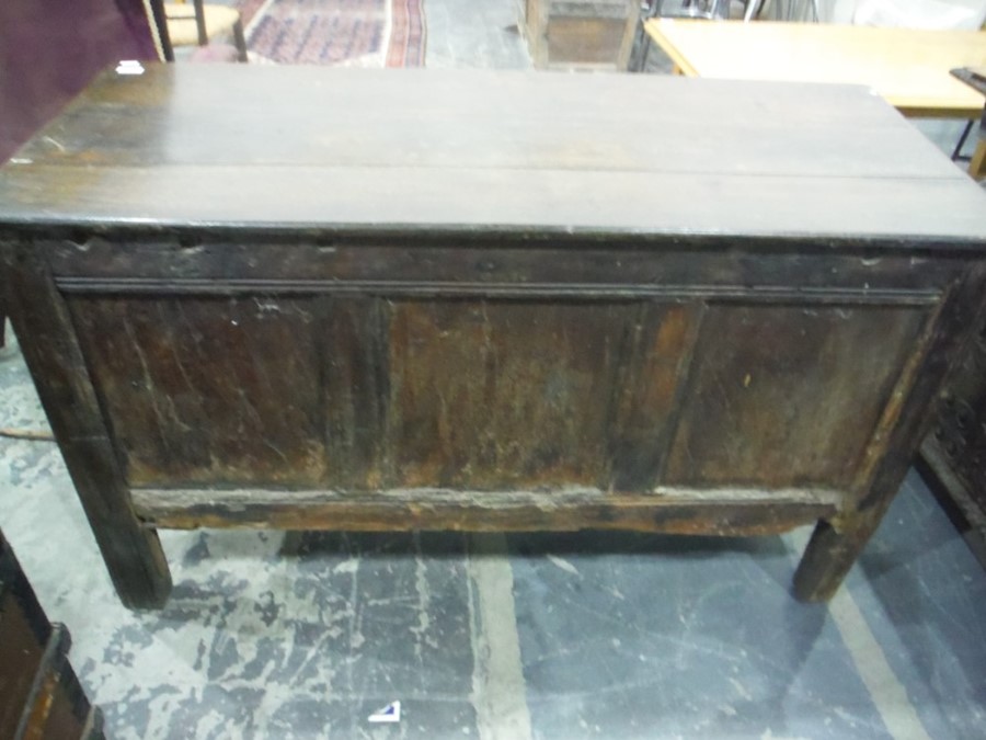 17th century oak coffer, the rectangular top with moulded edge, above the carved front emblazed with - Image 6 of 7