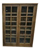 Old pine glazed storage cupboard, the pair of astragal-glazed panel doors enclosing four shelves,