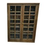 Old pine glazed storage cupboard, the pair of astragal-glazed panel doors enclosing four shelves,