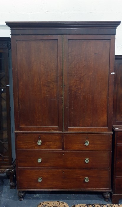 19th century mahogany linen press with ogee moulded pediment above the two doors, enclosing five