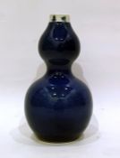 Chinese porcelain double-gourd vase, powder-blue glaze with reign mark to the rim, 23cm high