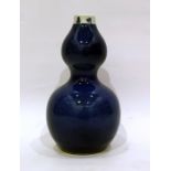 Chinese porcelain double-gourd vase, powder-blue glaze with reign mark to the rim, 23cm high