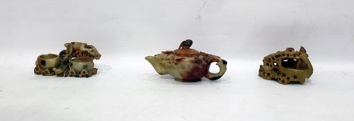 Soapstone teapot with prunus blossom decoration and a bird knop, two other soapstone carvings,