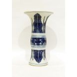 Late 19th/early 20th century Chinese vase of gu form, wide flared rim, the body decorated in blues