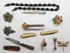 Quantity of costume jewellery including ceramic brooches, necklaces, watches, beads, pen knife,