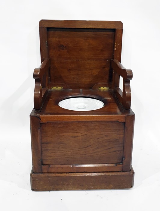 19th century mahogany commode, the top with canted corners and moulded edge, raising to reveal