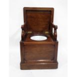 19th century mahogany commode, the top with canted corners and moulded edge, raising to reveal