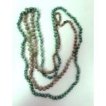 Graduated jade bead necklace and a green glass bead necklace (2)