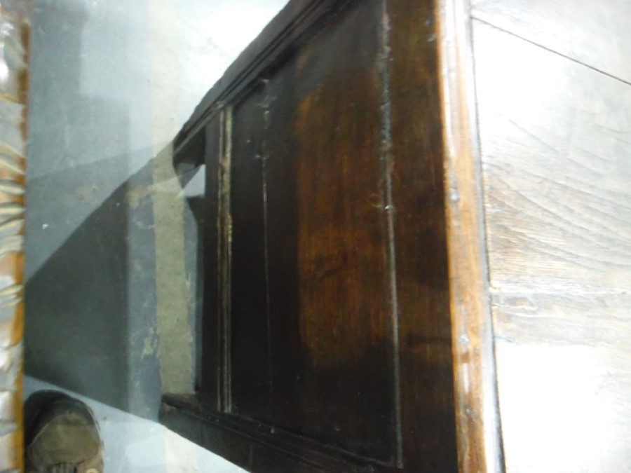 17th century oak coffer, the rectangular top with moulded edge, above the carved front emblazed with - Image 4 of 7