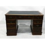 Early 20th century oak pedestal desk with moulded edge, above nine assorted drawers, to plinth base,