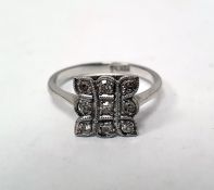 Platinum and diamond pave set ring, shaped square, with three rows of three each small diamonds,