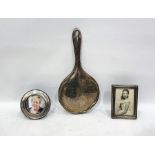 Silver backed hand mirror, a silver photograph frame of rectangular form, 10cm x 7cm and a silver