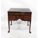 Possibly 18th century oyster walnut lowboy with moulded edge above one long and three short drawers,