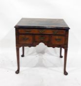 Possibly 18th century oyster walnut lowboy with moulded edge above one long and three short drawers,