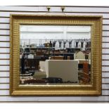 Rectangular wall mirror with bevelled edge in a gilt effect frame