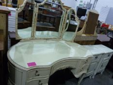 20th century cream dressing table with three part mirror above the serpentine-fronted body with five