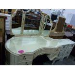 20th century cream dressing table with three part mirror above the serpentine-fronted body with five