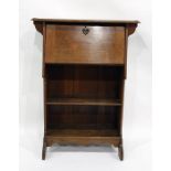 Early 20th century oak student's bureau, the fall above open book recesses, shaped apron
