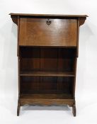 Early 20th century oak student's bureau, the fall above open book recesses, shaped apron