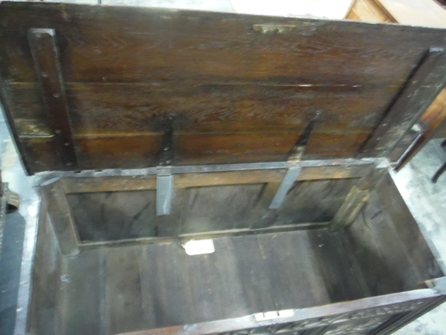 17th century oak coffer, the rectangular top with moulded edge, above the carved front emblazed with - Image 7 of 7