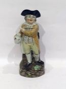 19th century Toby character jug standing figure with tri-form hat, clay pipe, holding jug of ale, on