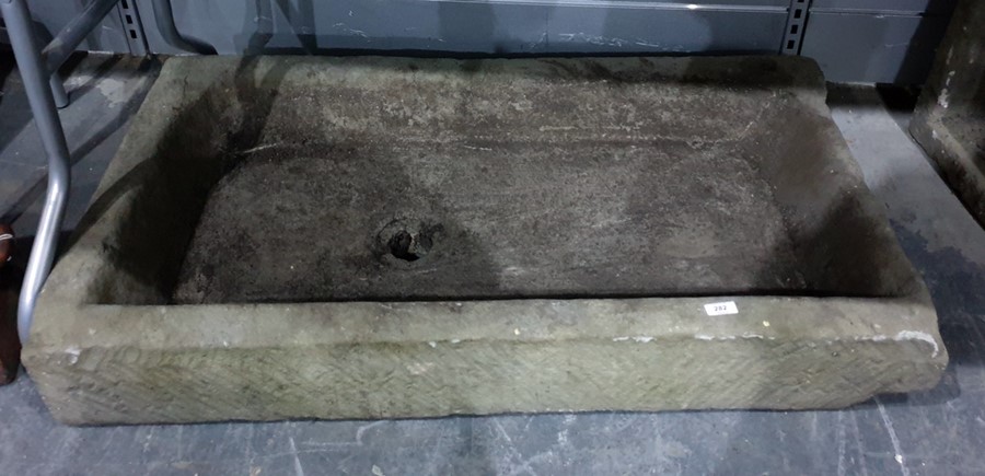 A large antique stone trough 104 x 67 cms