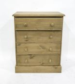 Modern pine chest of four drawers, to plinth base,