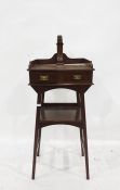 Early 20th century mahogany washstand with hexagonal mirror, raised upon a brass pole, above the