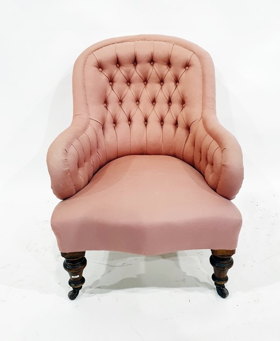 Lady's Victorian armchair in pale pink weave with slightly outscroll arms and on mahogany turned
