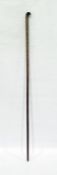 Antique measuring stick with curved end, tapering measurements to both sides and brass tip, possibly