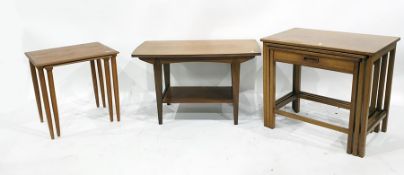 Nest of three G-Plan style teak occasional tables, rectangular, the smallest with single frieze