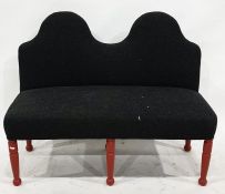 Early 20th century upholstered bench with shaped back, overstuffed seat and red painted turned front