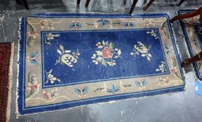 Pair of Chinese blue ground carpets, foliate dec