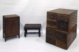 Pair of four-drawer chests, a mahogany single door table-top cupboard and a carved oak stool