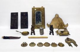 Two brass bear money boxes, a bell metal plaque, probably from weighing device, a brass inkstand,