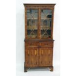 Two 20th century yew bookcase cabinets with astrag