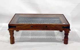 Eastern hardwood rectangular coffee table with glass top above the iron link decoration, on turned