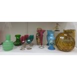 Large amber glass vase of dimpled globular form, an opaque green glass vase of ribbed bottle design,