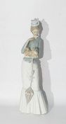 Lladro figure of a lady holding a Pekingese in her arms, with umbrella, approx 38cm high