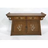 20th century Chinese sideboard with mother-of-pearl inlaid drawer and door fronts, raised on a