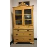 20th century pine dresser cabinet with arched top above two glazed doors, enclosing shelves, above