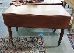 19th century mahogany Pembroke table with moulded edge above the four turned supports, to brass caps