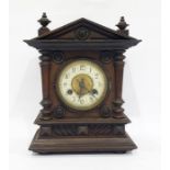 Early 20th century mantel clock with ivorine dial, in architectural walnut case, 30cm high