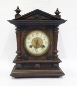 Early 20th century mantel clock with ivorine dial, in architectural walnut case, 30cm high