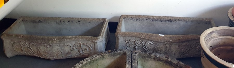Pair of reconstituted stone troughs, nicely weathered - decorated in relief with cherubs and