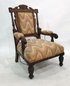 Victorian mahogany armchair with flame-stitched upholstered back and seat, turned front legs